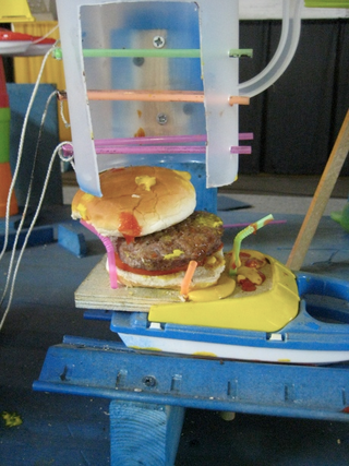 Illustration for article titled Purdue's 156-Step Burger Maker Wins Rube Goldberg Contest